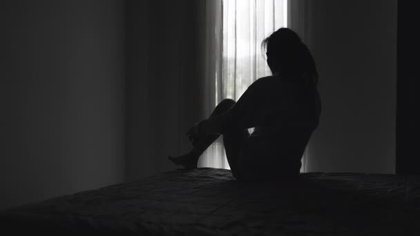 depositphotos_845069990-stock-video-silhouette-lonely-young-woman-feeling